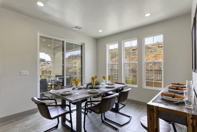 Dining table for six beside sliding doors to the covered patio