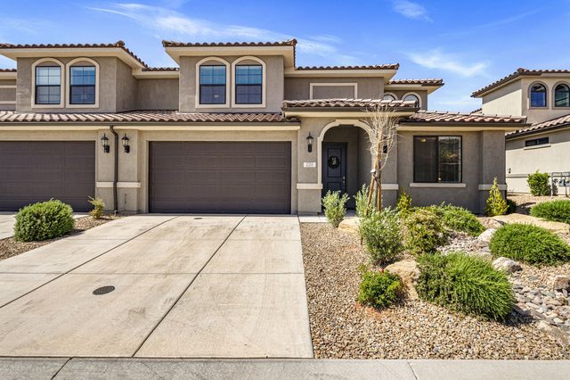 Front of Escondido 2355 with garage and landscaped desert front yard