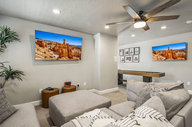 Upstairs loft with sectional sofa, wall TV and shuffleboard table in 2355