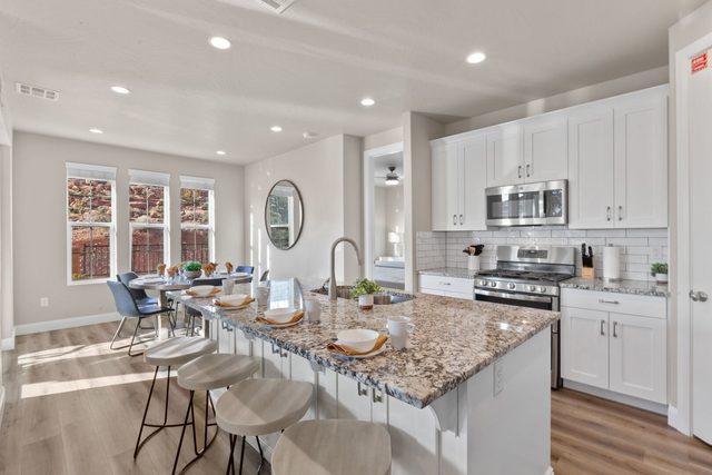 Kitchen island seating open to the dining nook