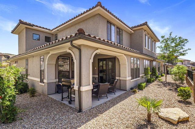Rear exterior of Escondido 2355 with covered patio and landscaping