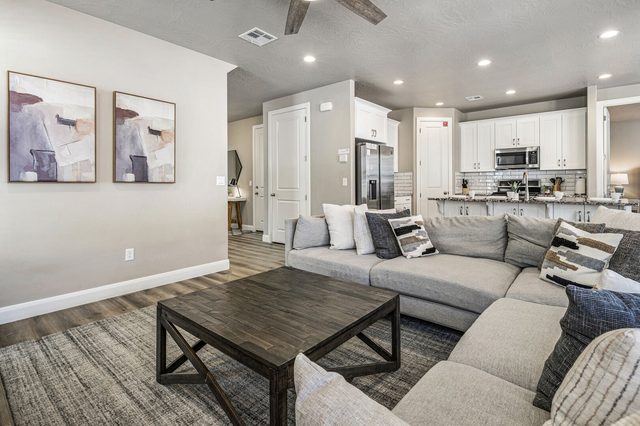 Open great room flowing into the kitchen at Escondido 2355