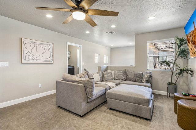 Loft sitting area with sectional sofa and ottoman