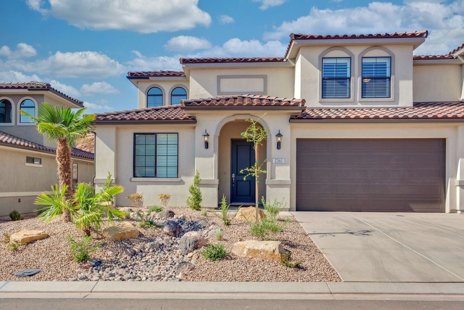 Front of Escondido 2361 with tile roof and garage