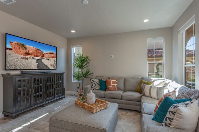 Living room sectional and large TV at Escondido 2361