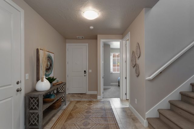 Entry hallway with console table beside the staircase