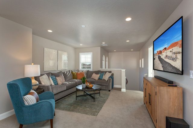 Upstairs loft lounge with sectional and large TV