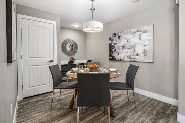 Round dining table with four chairs in the dining nook