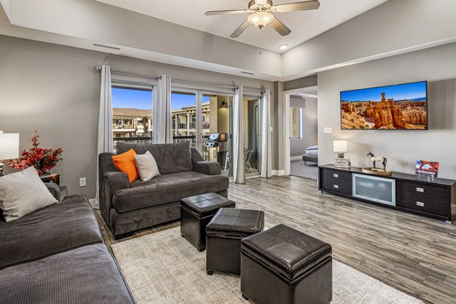 Living room sofa and TV beside the balcony sliding doors