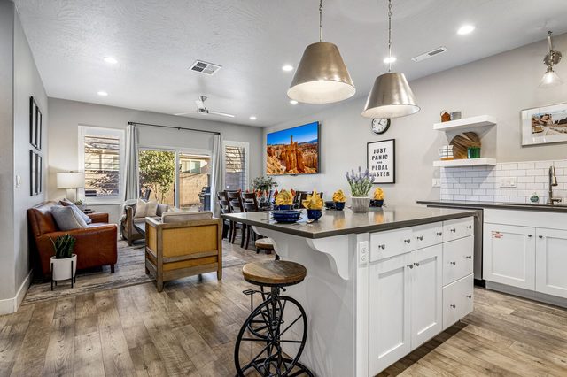 Kitchen island with bike-style stools and open living area