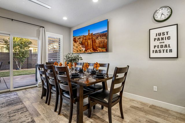 Dining table for eight beside patio sliding doors