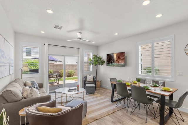 Home 529 living and dining area with sofa, chairs and table