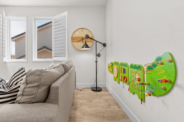Upstairs family room sofa with wall-mounted activity toy