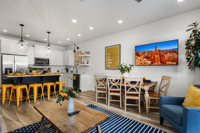 Open living room facing the kitchen and dining table