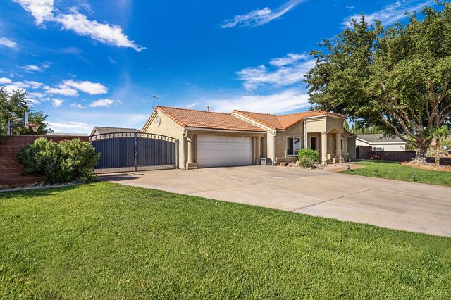 Hurricane 3819 driveway, gated side yard and two-car garage