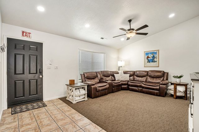 Leather reclining sectional beside the front door