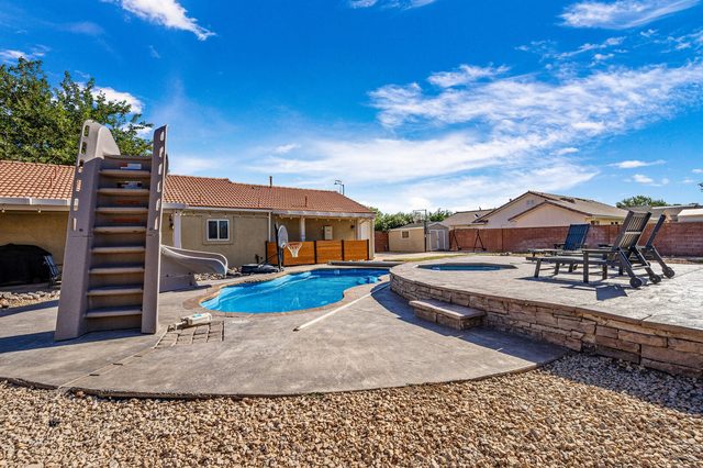 Private pool with tall water slide and raised spa