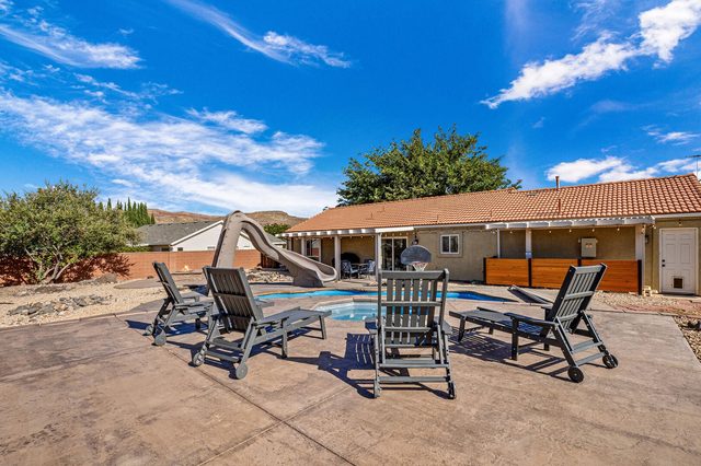 Pool deck loungers around the private pool and slide