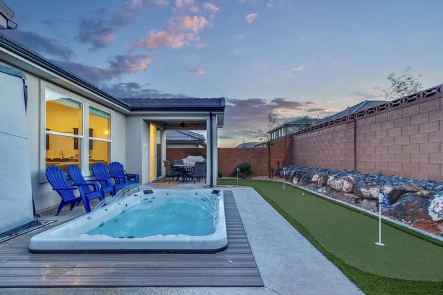 Private swim spa beside the putting green at Ladera 325 at dusk