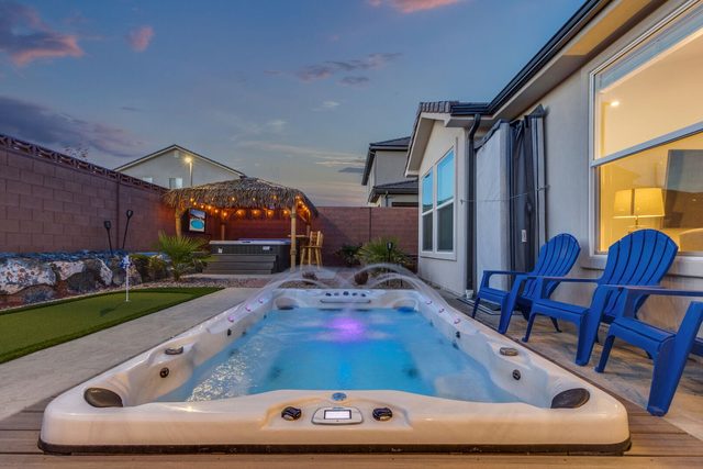 Lit private swim spa with Adirondack chairs at Ladera 325