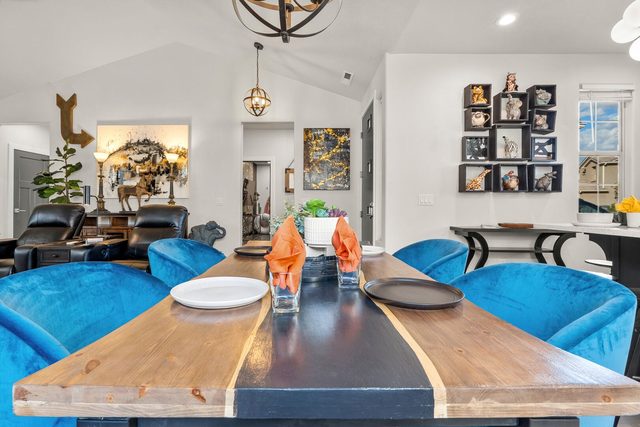 Live-edge river dining table with blue velvet chairs