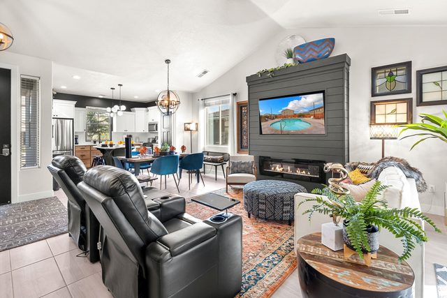 Great room with leather recliners and TV fireplace wall at Ladera 347