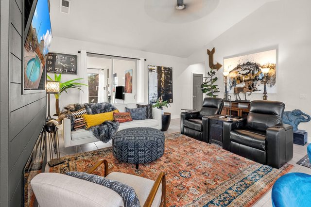 Great room with leather power recliners and designer rug