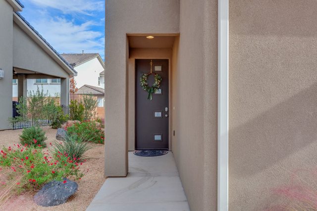 Front entry walkway with desert landscaping at Ladera 370