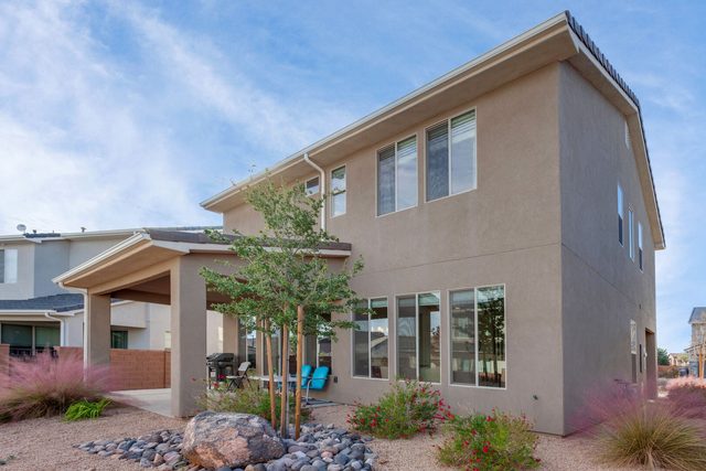 Rear exterior with covered patio and desert landscaping at Ladera 370
