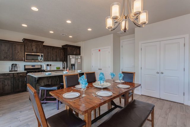 Dining table set for eight next to the kitchen at Ladera 370