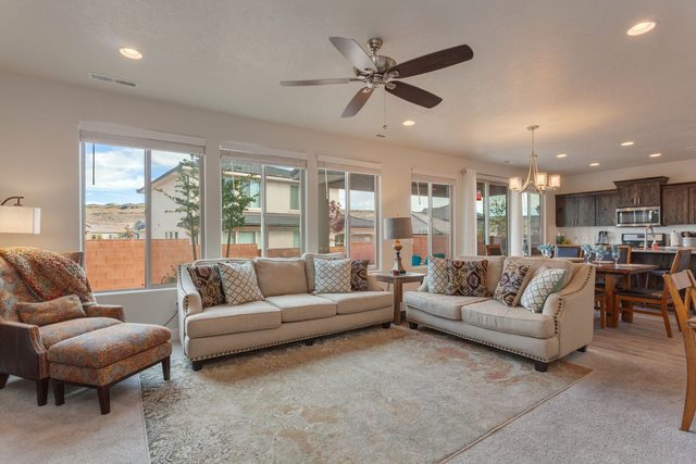 Open living room with two sofas and dining beyond at Ladera 370