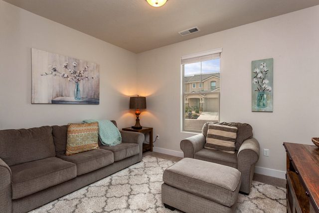 Den with sectional sofa and armchair ottoman at Ladera 370