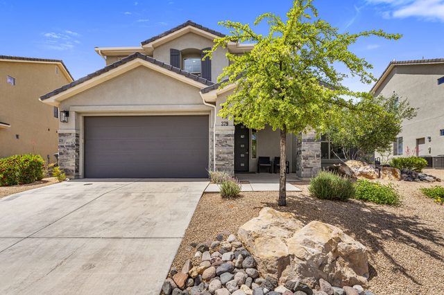 Front of Ladera 379 with two-car garage and desert landscaping