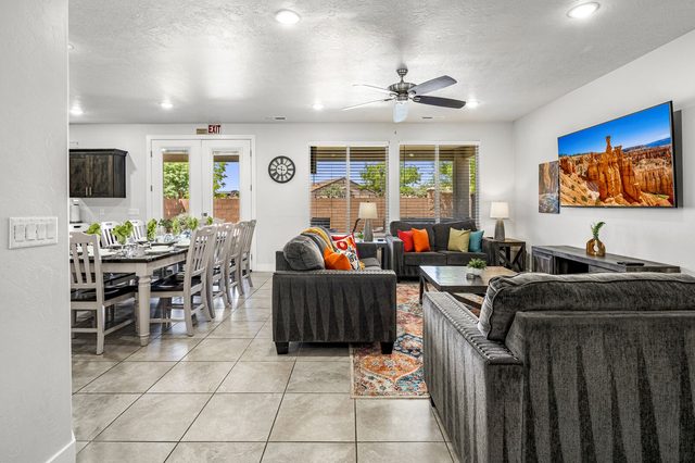 Open living room and long dining table at Ladera 379
