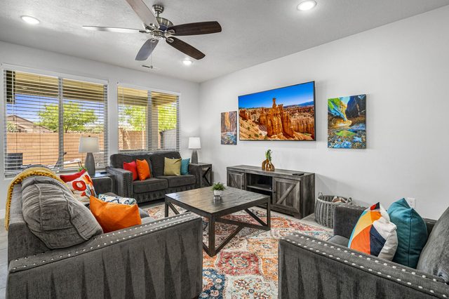 Living room with sectional seating and large TV at Ladera 379
