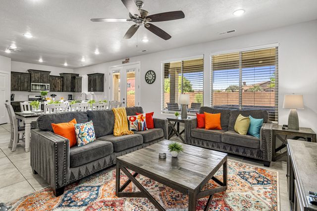 Living room sofas with the kitchen and dining area beyond at Ladera 379