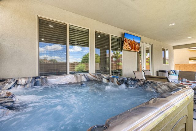 Bubbling private hot tub facing the living room windows at Ladera 379