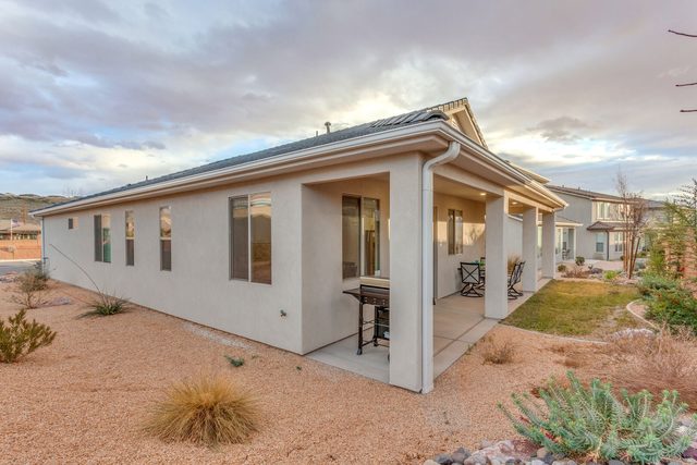 Rear of Ladera 415 with covered patio and desert landscaping