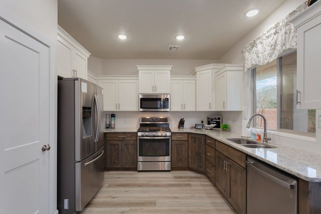 Kitchen with stainless appliances and granite counters at Ladera 415