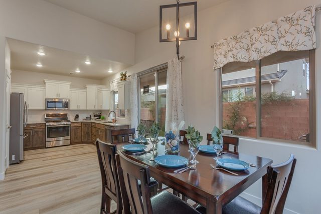 Dining table for six beside the kitchen at Ladera 415