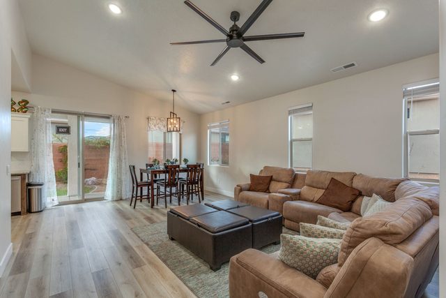Open living room with sectional and dining area beyond at Ladera 415