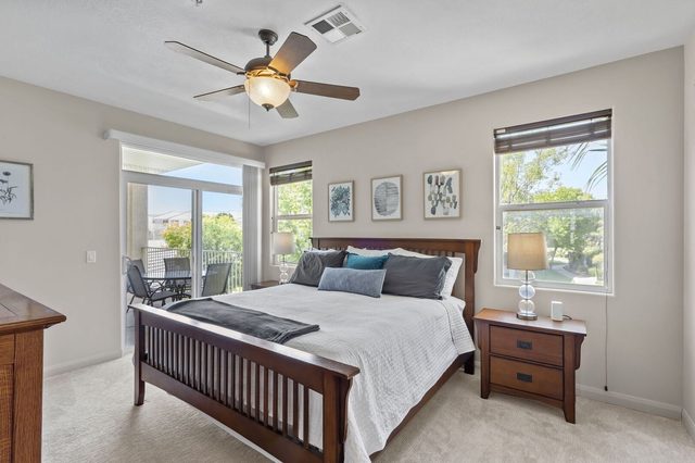 Master bedroom with king bed and balcony access at Las Palmas 1805