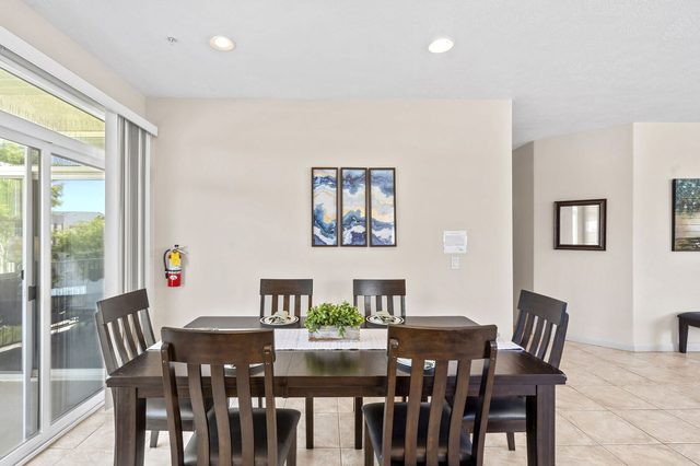 Dining area with seating next to the outdoor patio doors