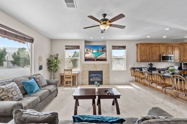 Living room with sofas, gas fireplace and TV at Las Palmas 1805