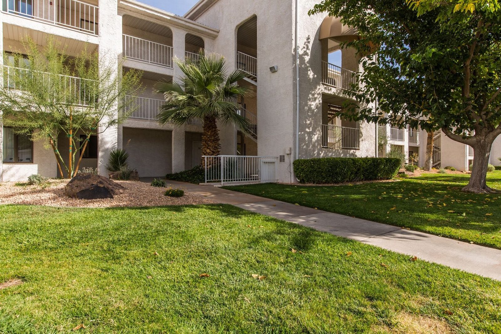 Green lawn and landscaping outside the Las Palmas 2012 building