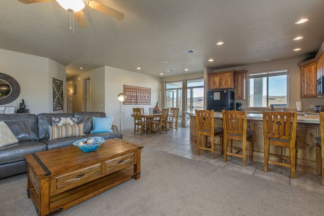 Living area opening to the kitchen bar and dining table