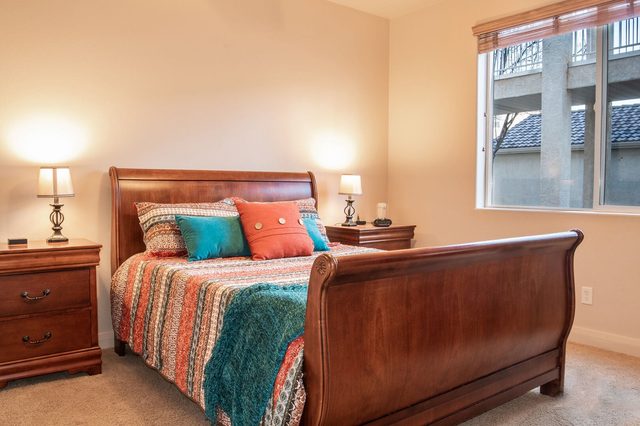 Second bedroom with queen sleigh bed at Las Palmas 2102