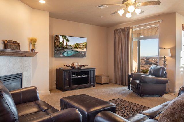Great room with leather sofas, gas fireplace and flat screen TV
