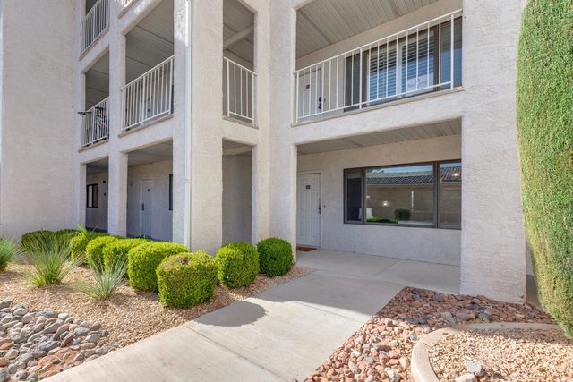 Walkway and landscaping outside the Las Palmas condo building