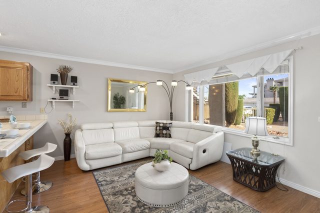 White leather sectional and ottoman in the Las Palmas 304 living room